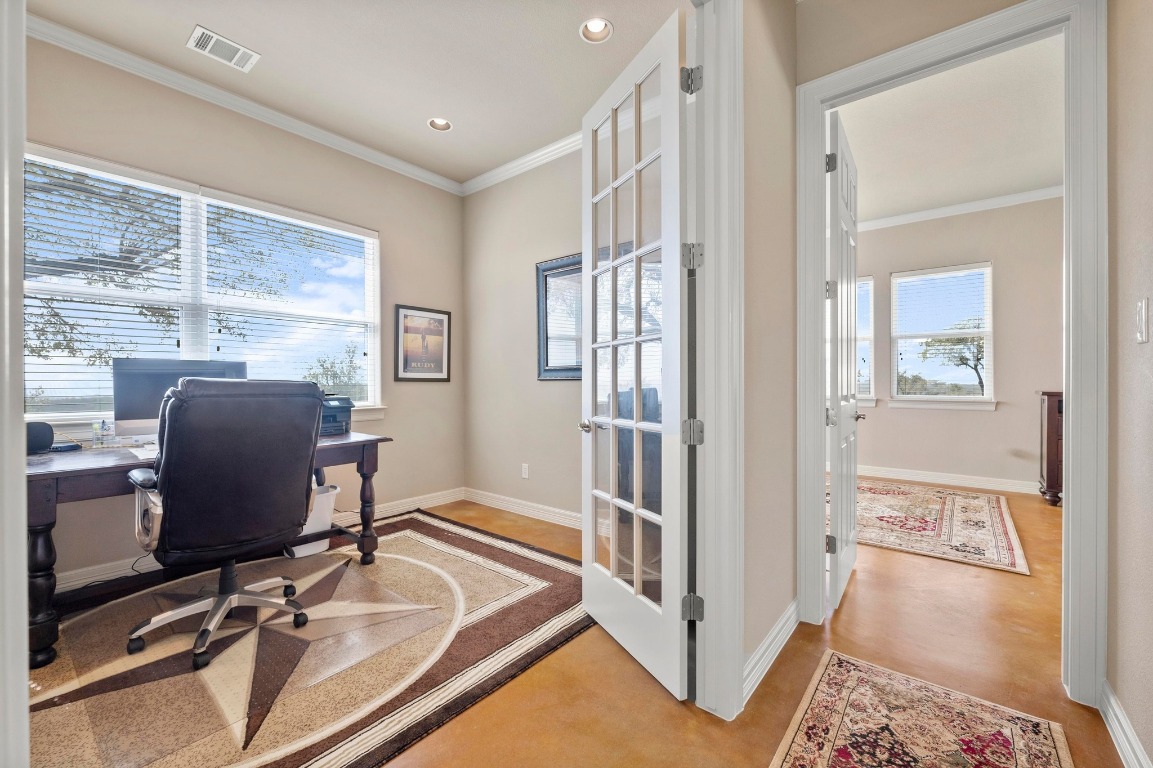 28701 Valley Road Marble Falls, TX 78654 - Photo 12 of 36 a view of a workspace with furniture and a window