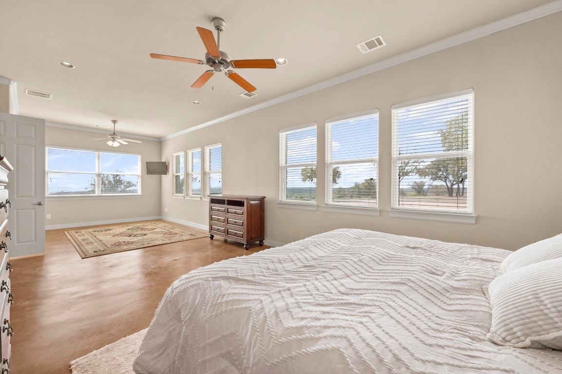 28701 Valley Road Marble Falls, TX 78654 - Photo 15 of 36 a bed room with a bed and a window