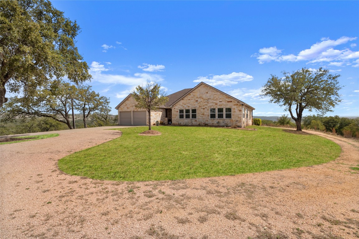 28701 Valley Road Marble Falls, TX 78654 - Photo 3 of 36 a view of a house with a yard