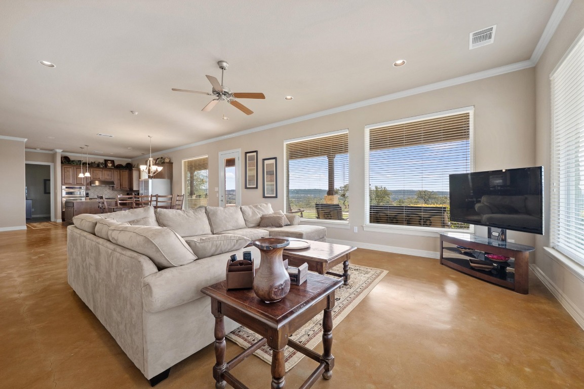 28701 Valley Road Marble Falls, TX 78654 - Photo 9 of 36 a living room with furniture and a flat screen tv