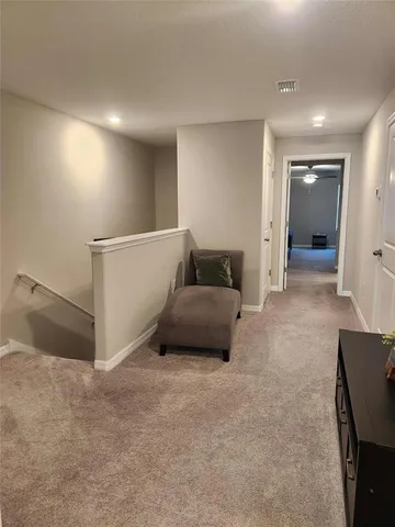 a living room with furniture and a walk in closet