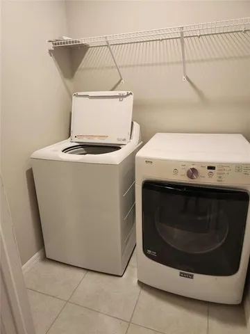 a utility room with a washer and dryer
