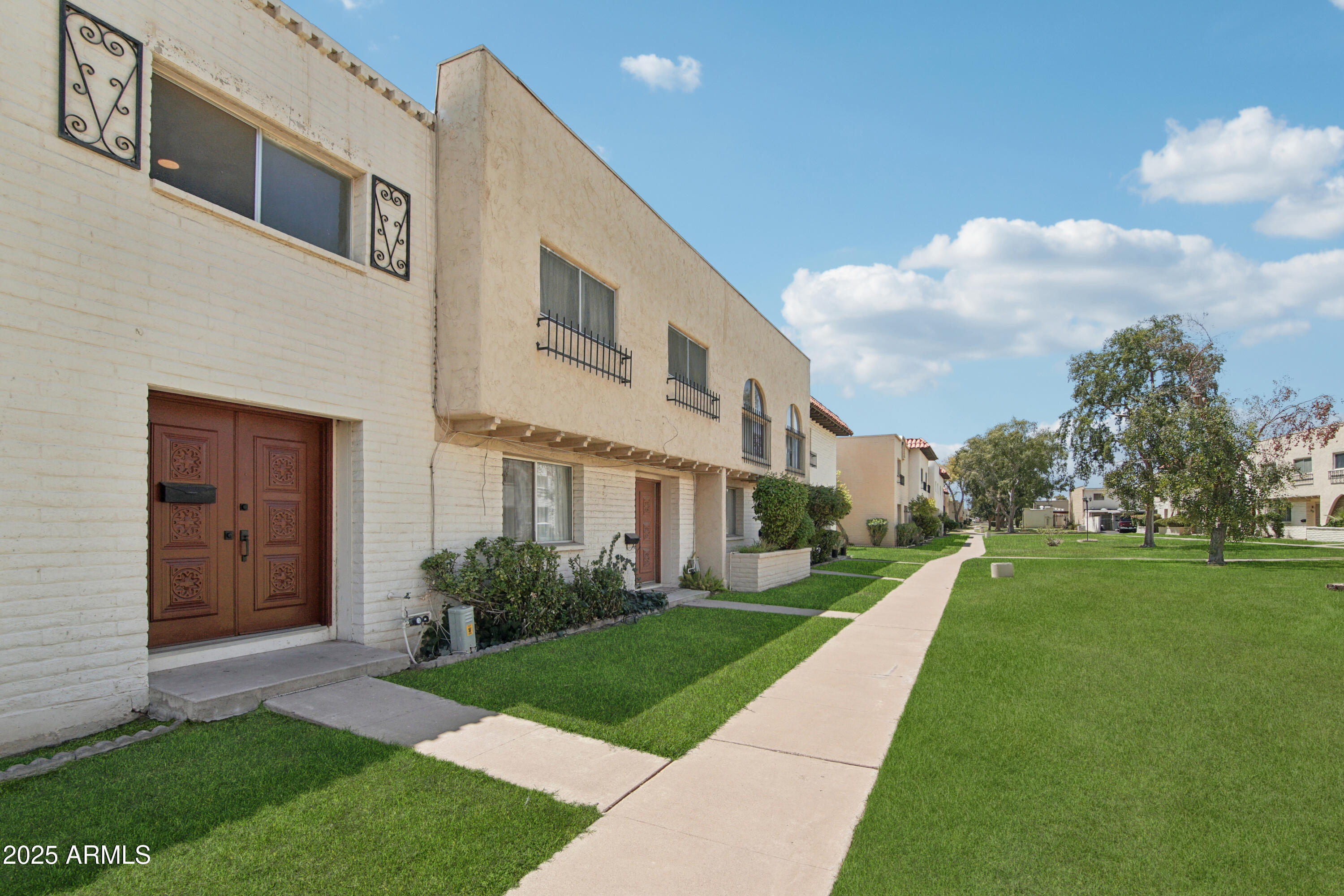 a front view of a house with a yard