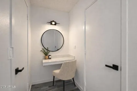 a bathroom with a sink a toilet and a mirror