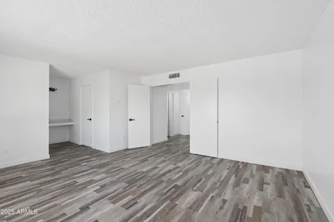 a bedroom with double bed and a window