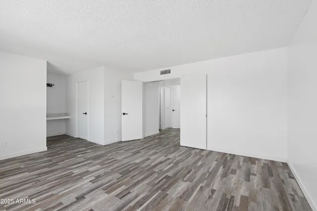 a bedroom with double bed and a window