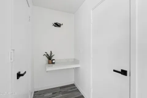 a view of an empty room and wooden floor