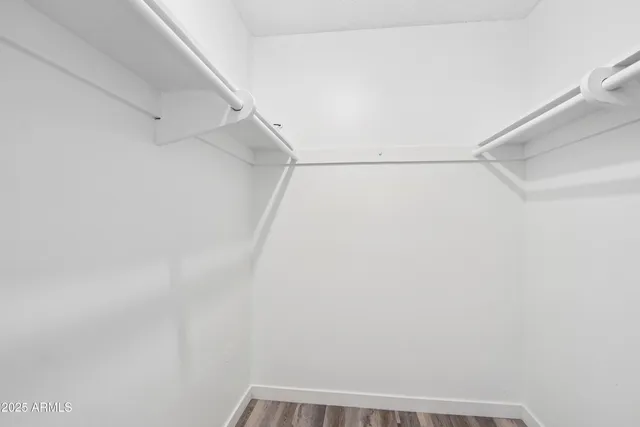 a bathroom with a sink mirror vanity and toilet
