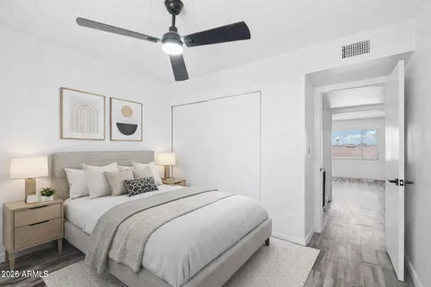 a view of a swimming pool with outdoor seating and yard in the back