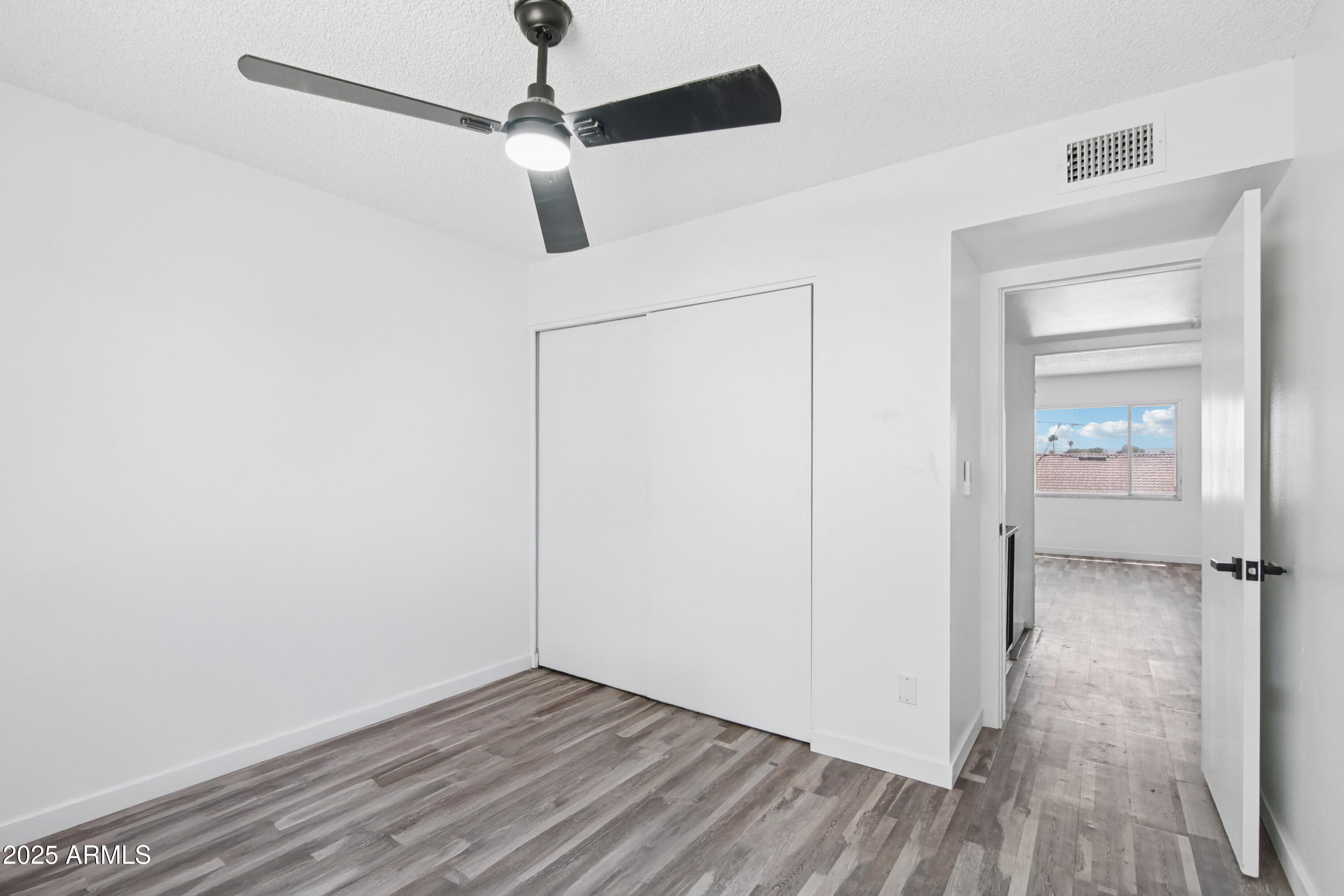 4606 North 19th Avenue Phoenix, AZ 85015 - Photo 24 of 36 wooden floor in an empty room