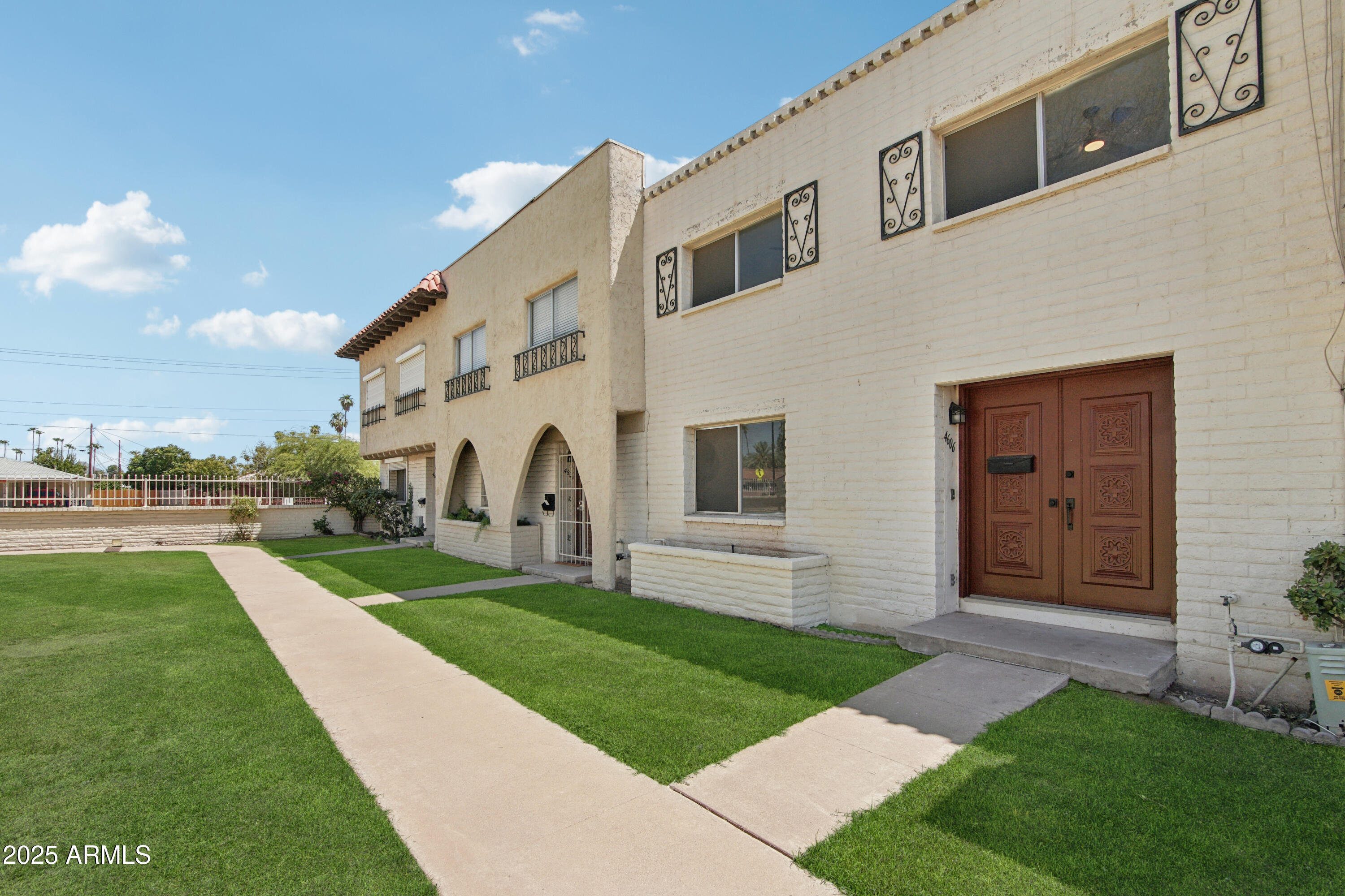 4606 North 19th Avenue Phoenix, AZ 85015 - Photo 33 of 36 a front view of a house with a yard