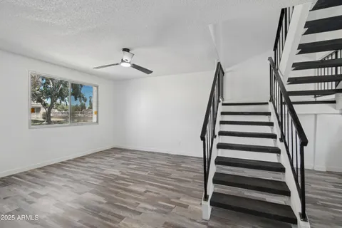 a kitchen with stainless steel appliances granite countertop a refrigerator and a stove top oven