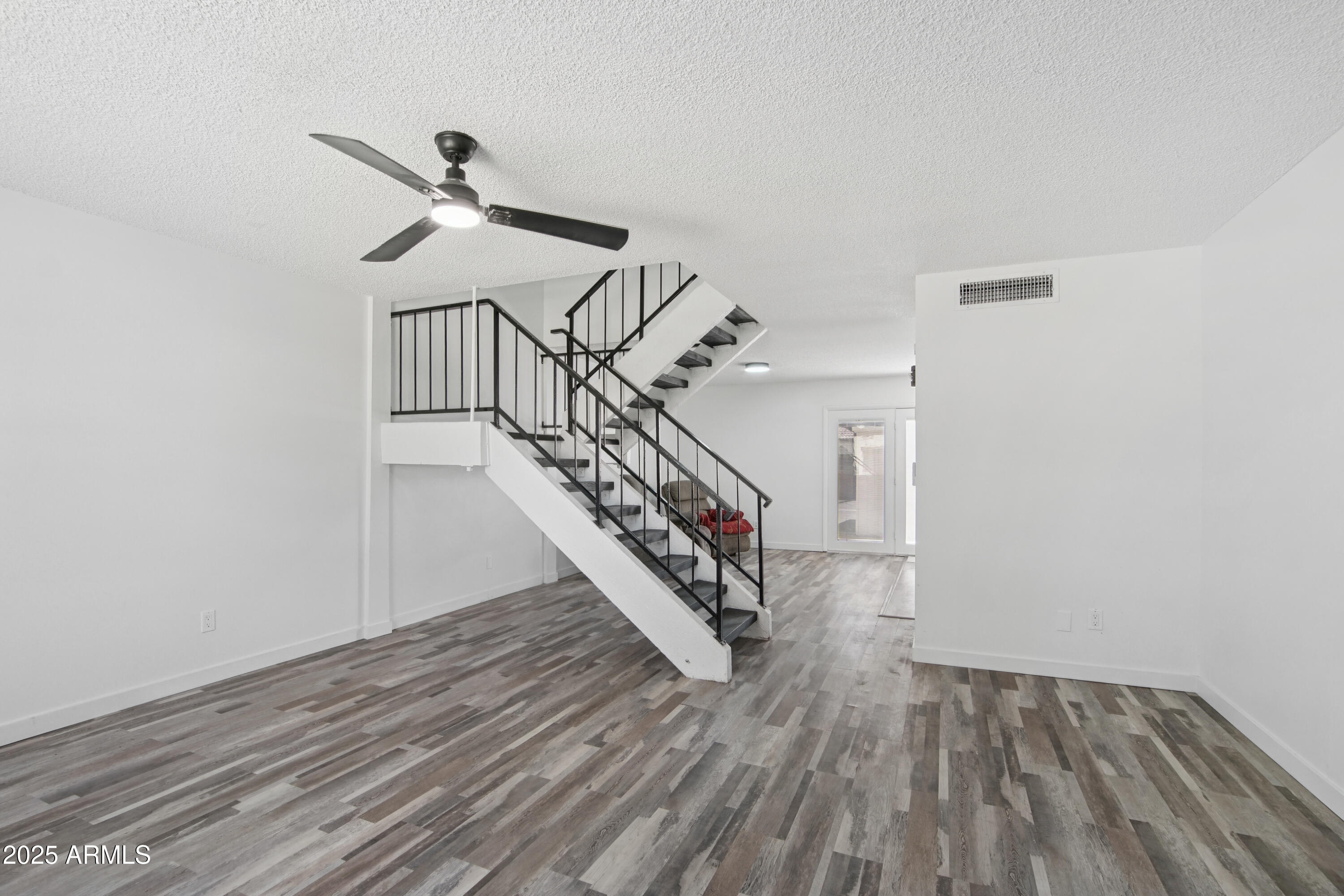 4606 North 19th Avenue Phoenix, AZ 85015 - Photo 6 of 36 a view of entryway and hall with wooden floor