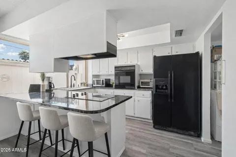 a view of storage and utility room with washer and dryer