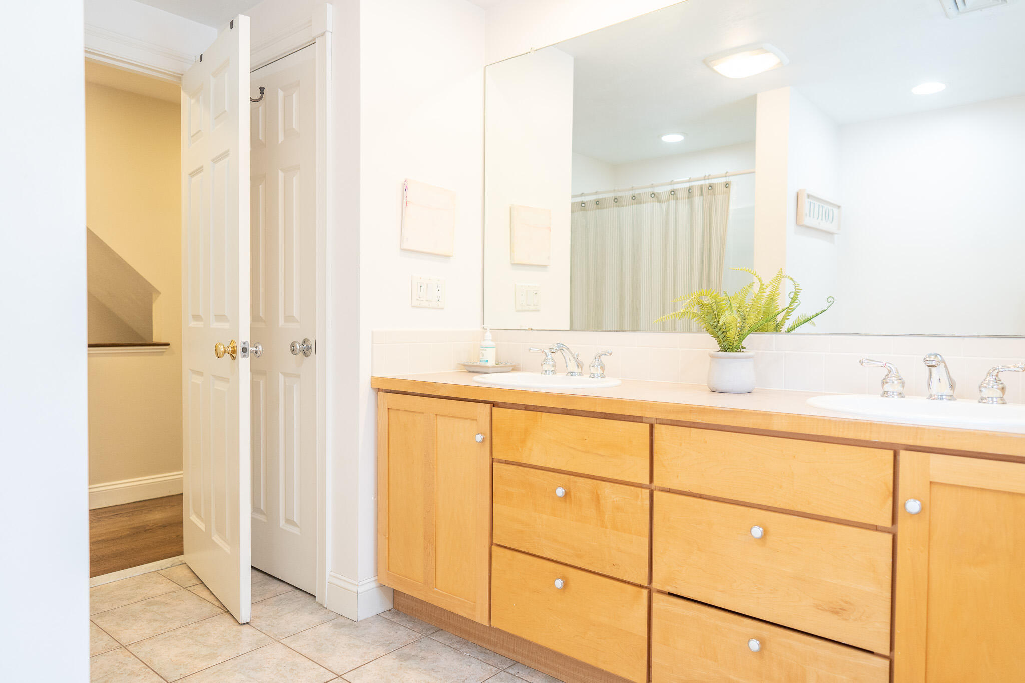 10 Abbey Gate Road Cotuit, MA 02635 - Photo 47 of 67 a bathroom with a double vanity sink and a mirror