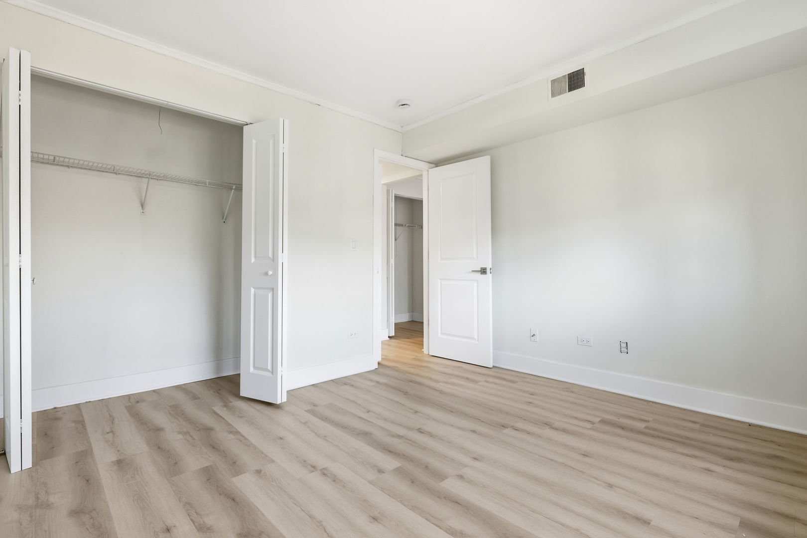 382 Oak Trails Road, Unit 301 Des Plaines, IL 60016 - Photo 16 of 24 a view of an empty room with wooden floor