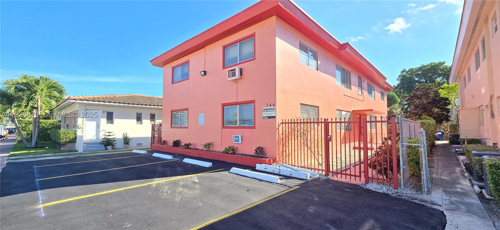 744 85th Street, Unit 1 Miami Beach, FL 33141 - Photo 1 of 13 a front view of a house with balcony