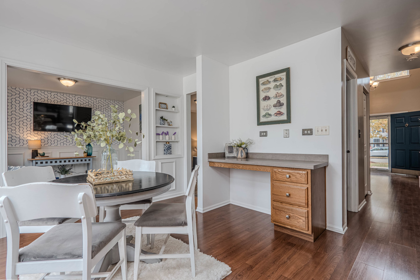 215 Alexis Street Plano, IL 60545 - Photo 11 of 42 a living room with furniture and a wooden floor