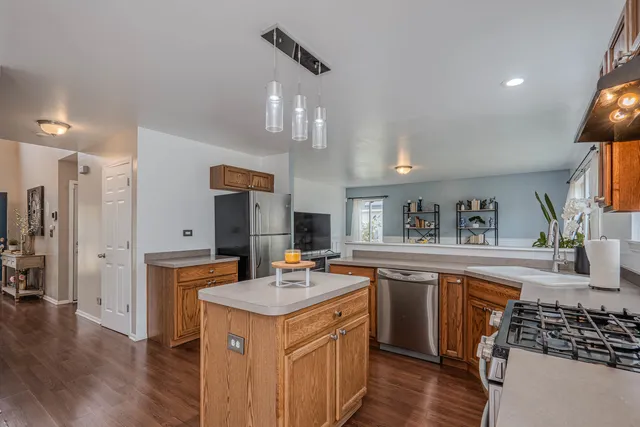 a kitchen with a sink stove and cabinets