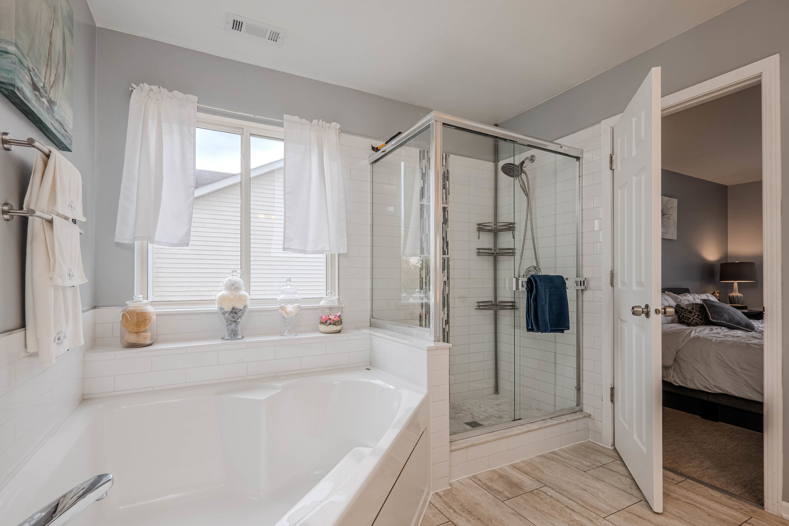 215 Alexis Street Plano, IL 60545 - Photo 29 of 42 a bathroom with a tub shower and a sink