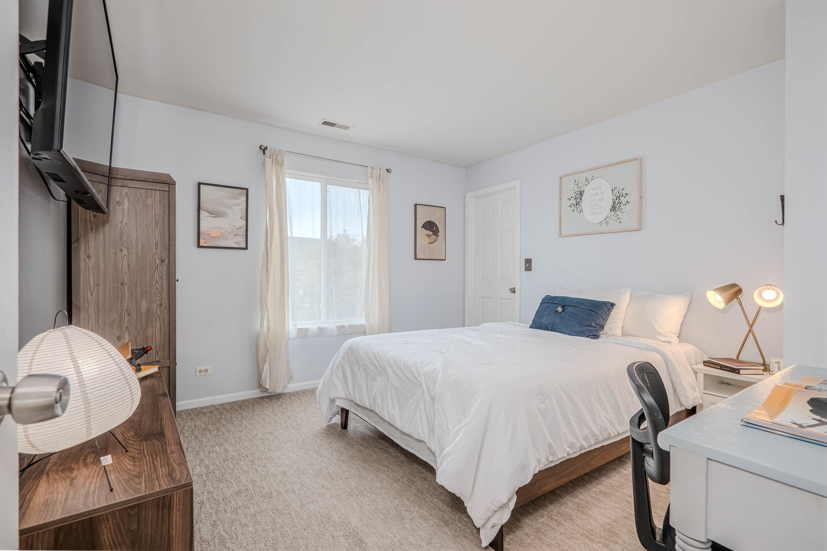 215 Alexis Street Plano, IL 60545 - Photo 30 of 42 a bedroom with a bed and dresser