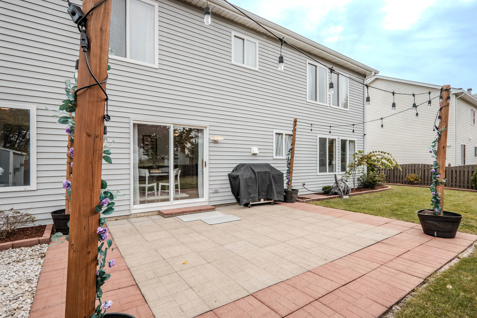 215 Alexis Street Plano, IL 60545 - Photo 35 of 42 a view of a house with backyard and sitting area