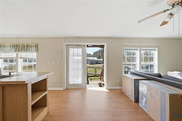 a view of a kitchen with a sink and dishwasher with a large window