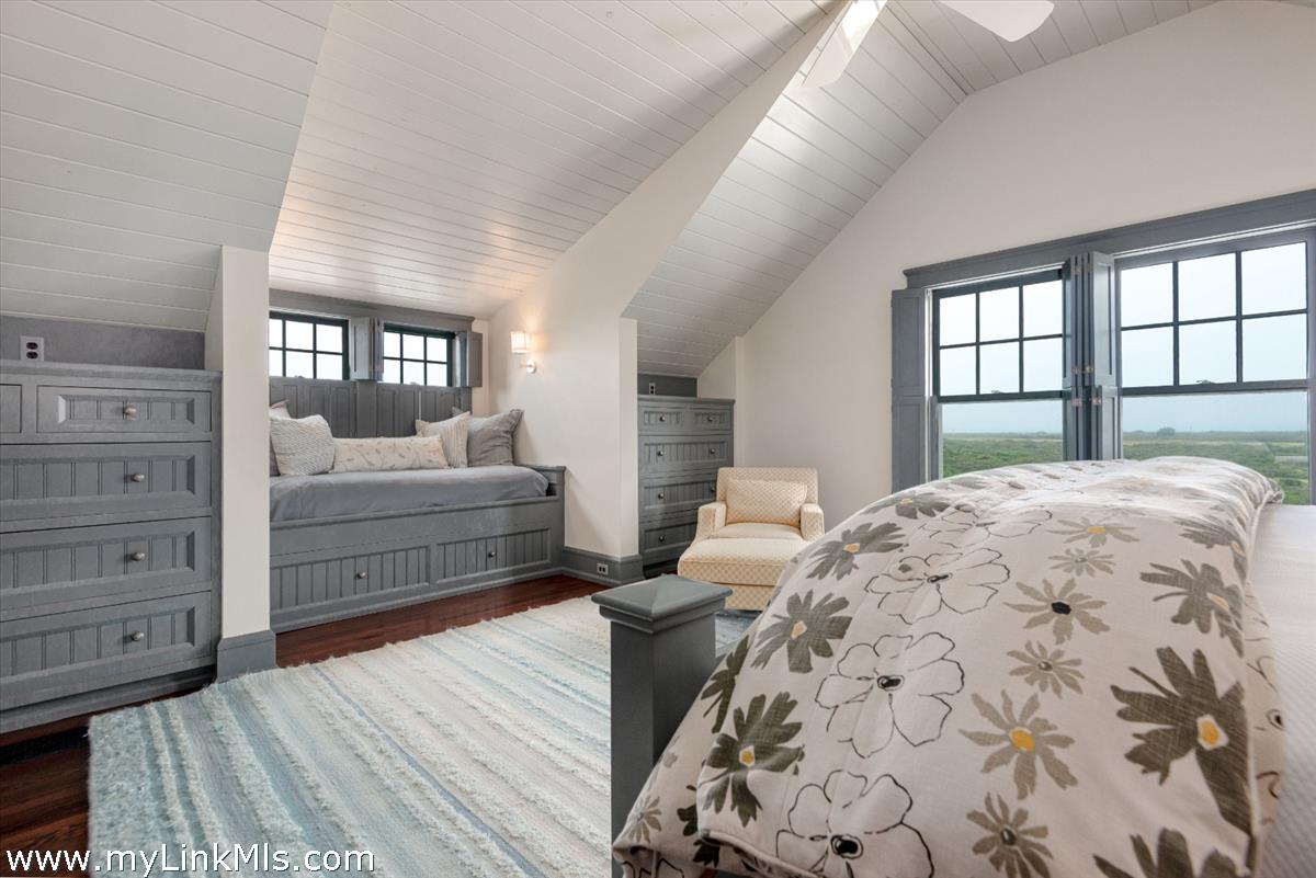 37 Sankaty Head Road Nantucket, MA 02554 - Photo 59 of 65 a bedroom with a large bed and a dresser