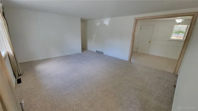 an empty room with mirror