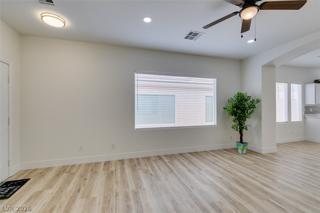10959 Pumpkin Ridge Avenue Las Vegas, NV 89135 - Photo 7 of 51 Pristine living space features new flooring and abundant natural illumination.