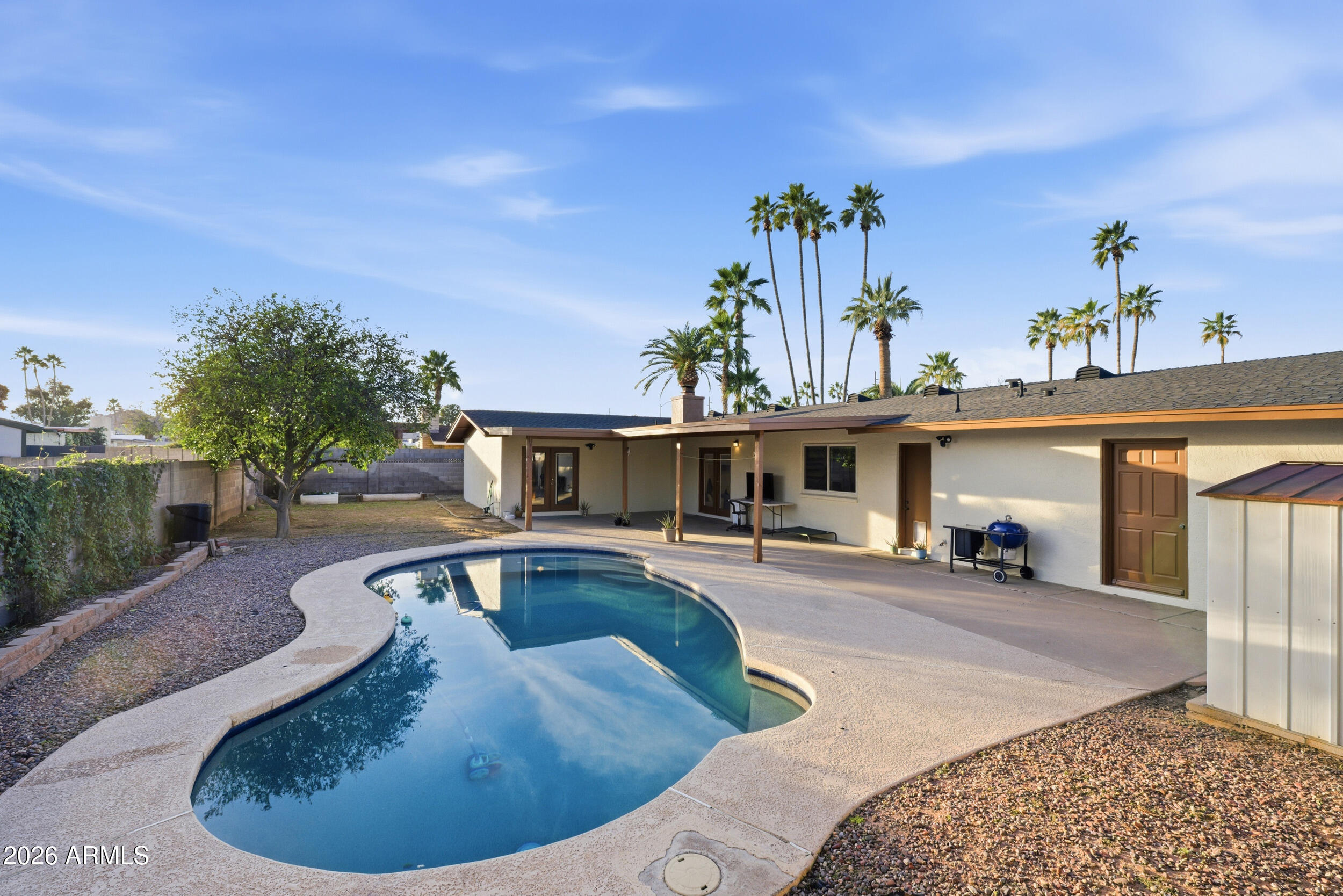 3541 East Cannon Drive Phoenix, AZ 85028 - Photo 12 of 42 a view of a house with swimming pool and sitting area