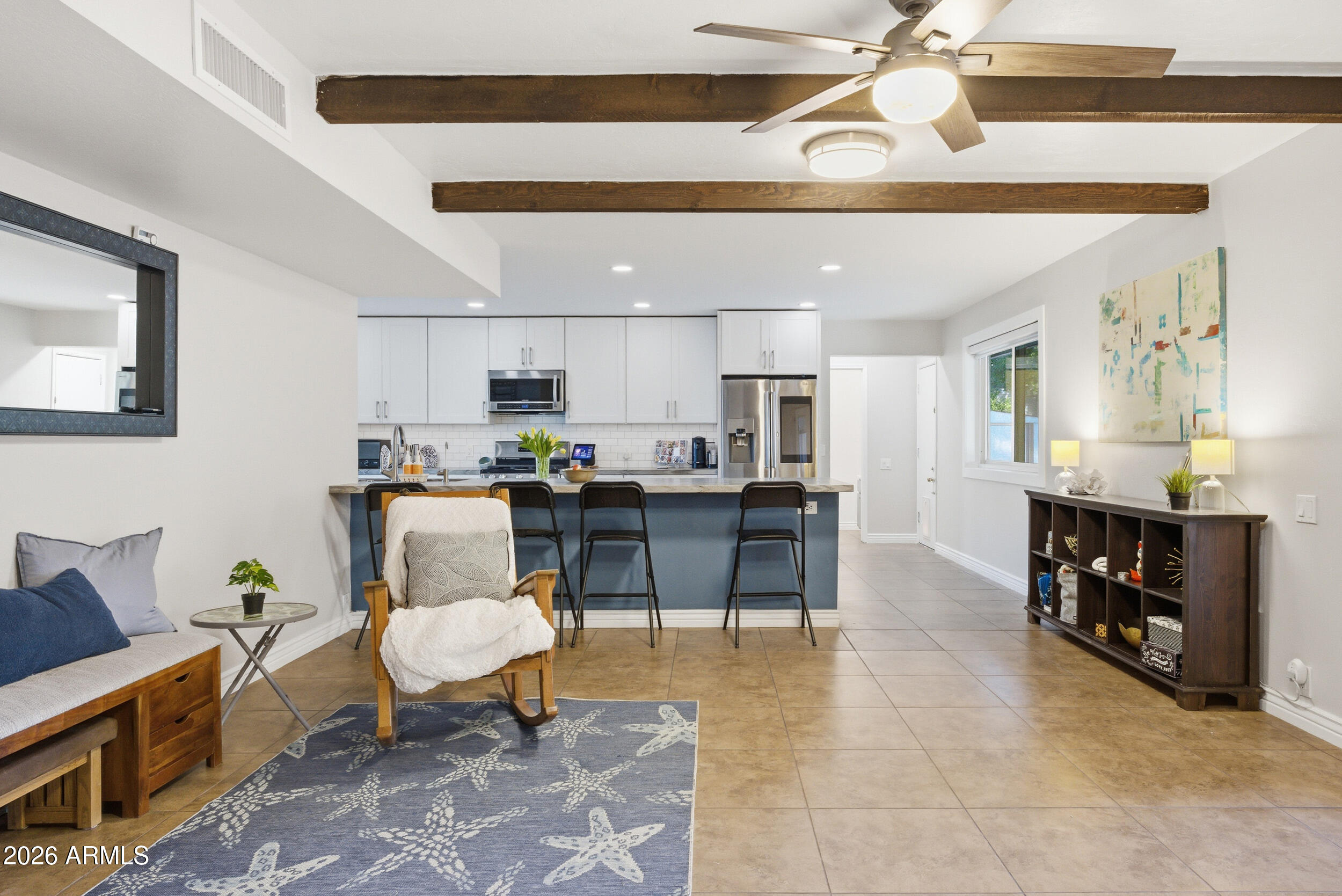 3541 East Cannon Drive Phoenix, AZ 85028 - Photo 18 of 42 a living room with furniture and kitchen view