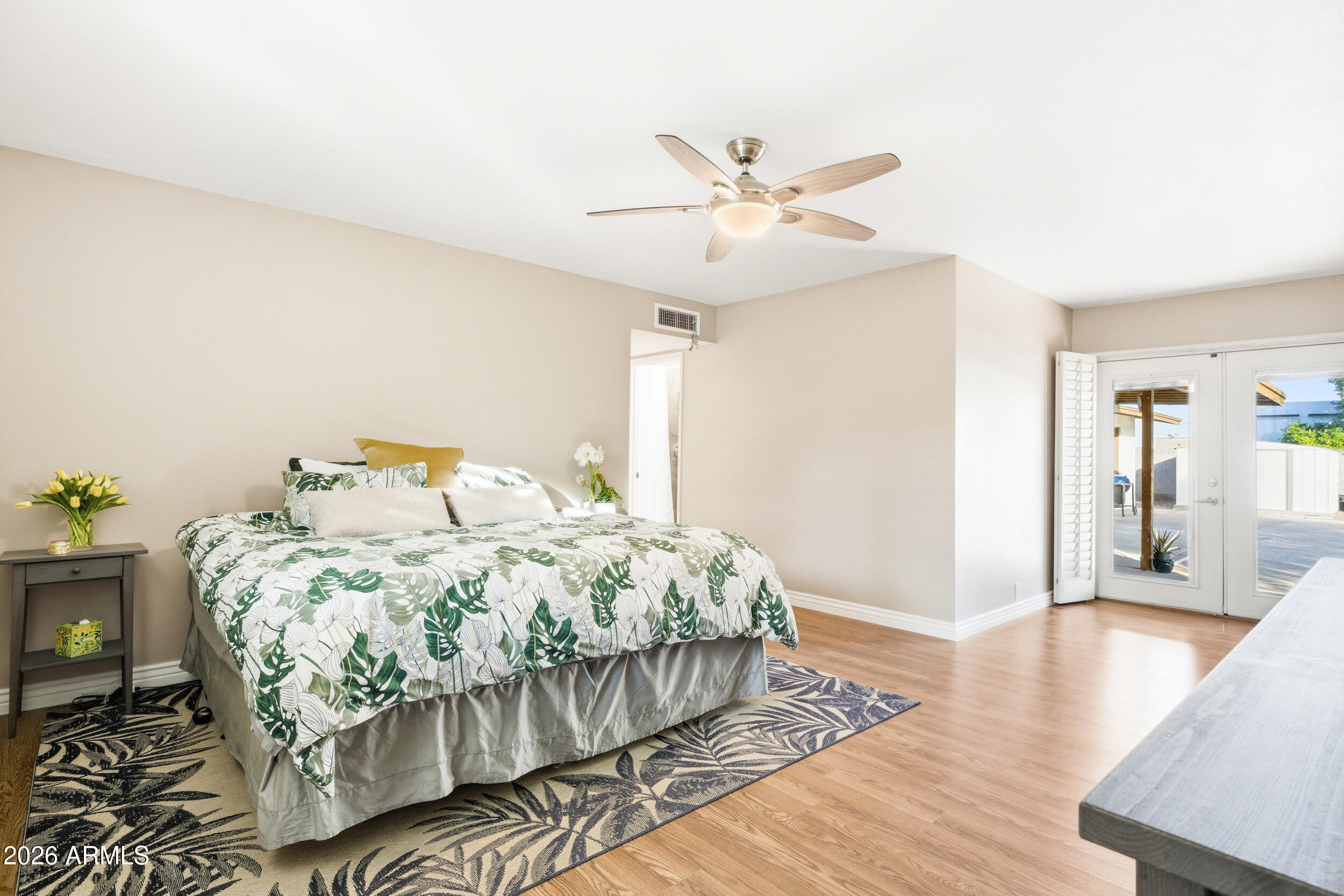 3541 East Cannon Drive Phoenix, AZ 85028 - Photo 22 of 42 a bedroom with a bed and wooden floor