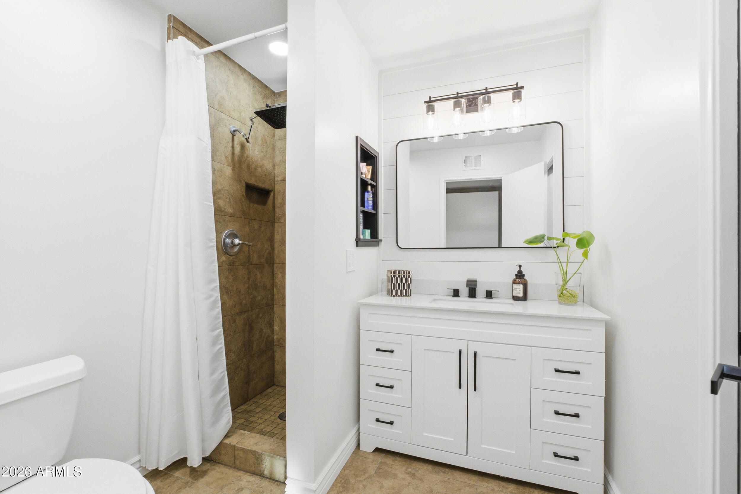 3541 East Cannon Drive Phoenix, AZ 85028 - Photo 25 of 42 a bathroom with a toilet sink and mirror