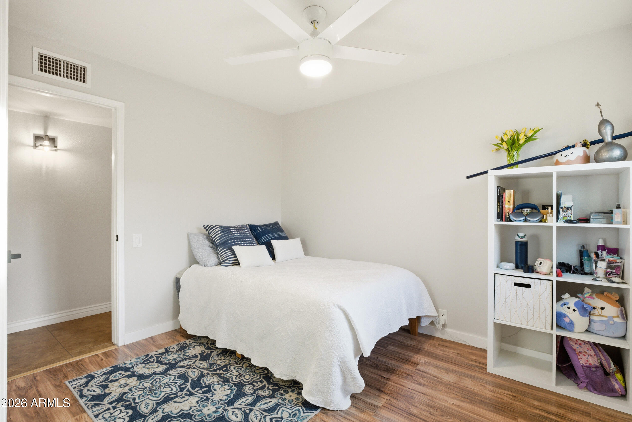 3541 East Cannon Drive Phoenix, AZ 85028 - Photo 31 of 42 a bedroom with a bed and wooden floor