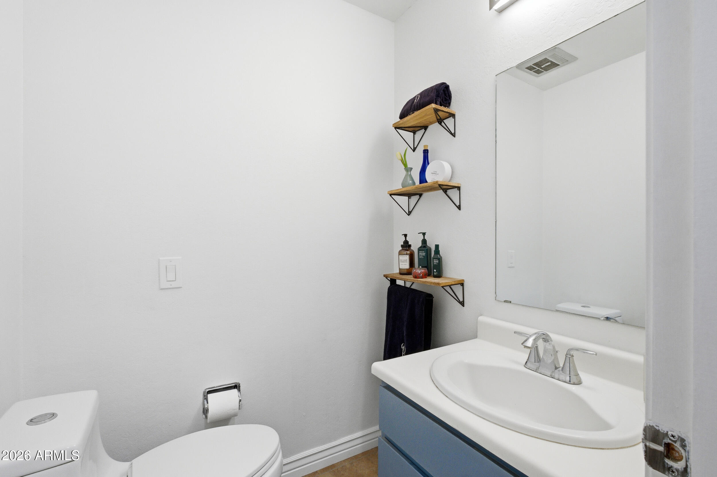 3541 East Cannon Drive Phoenix, AZ 85028 - Photo 35 of 42 a bathroom with a sink toilet and mirror
