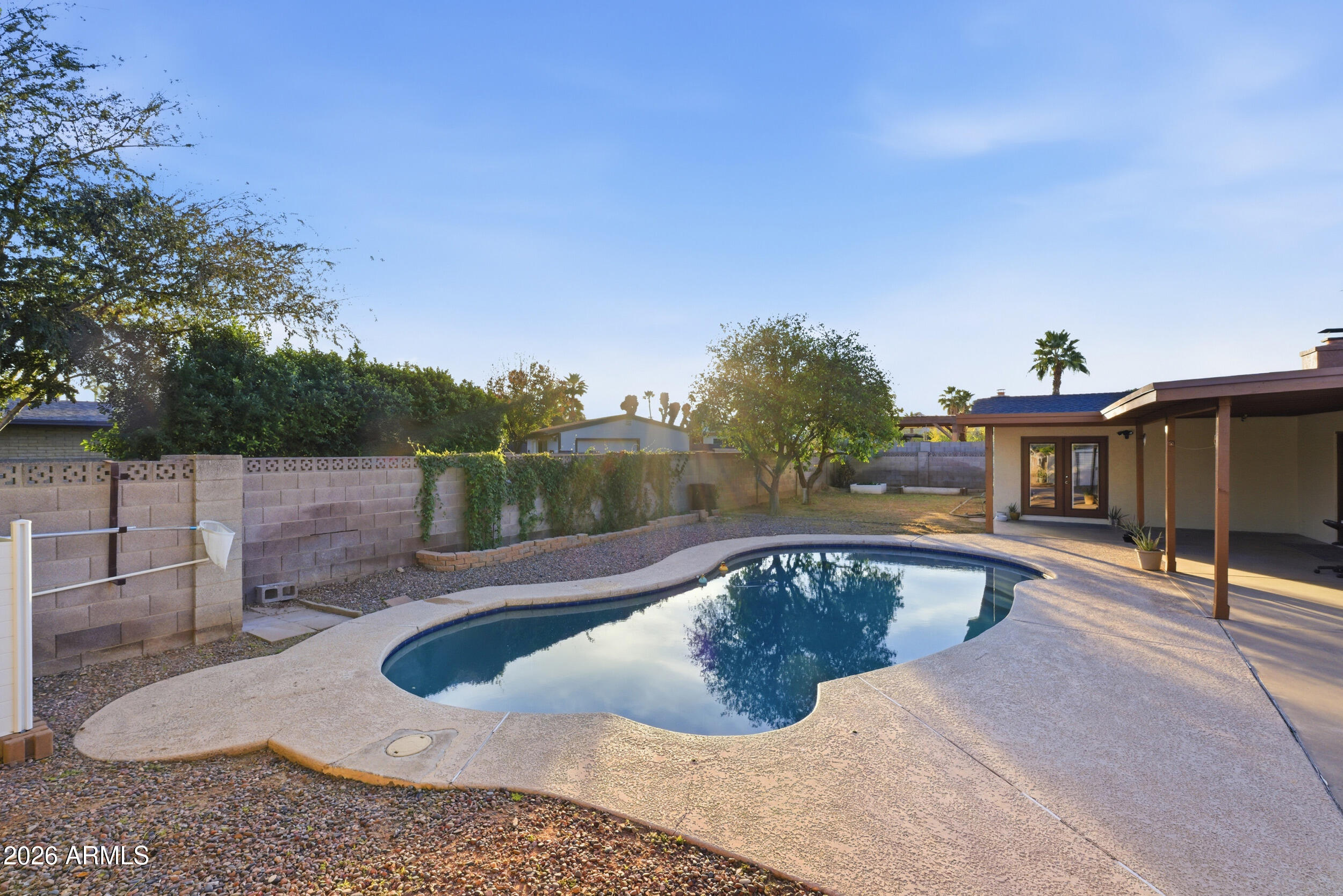 3541 East Cannon Drive Phoenix, AZ 85028 - Photo 39 of 42 a view of a swimming pool with a lounge chair