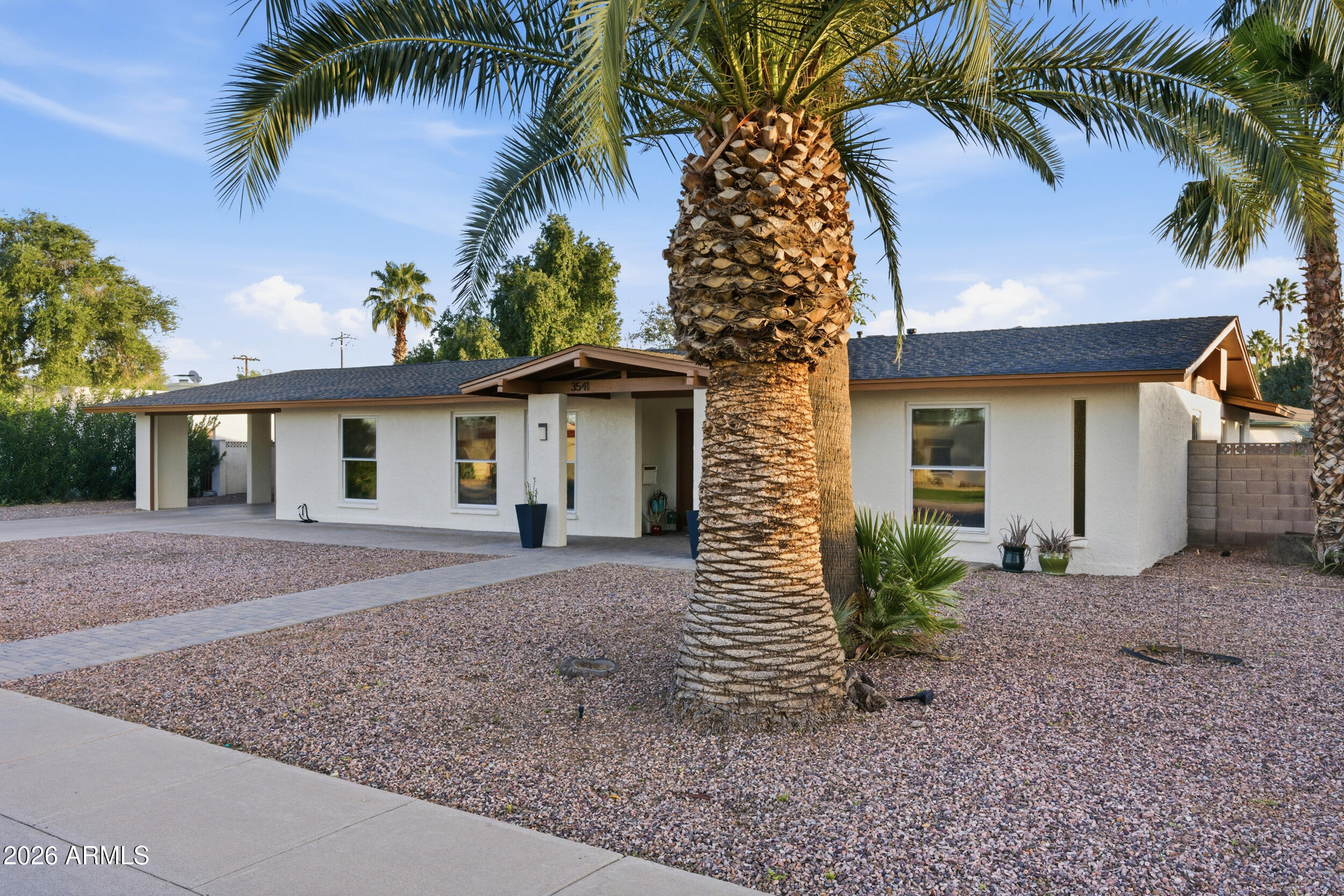 3541 East Cannon Drive Phoenix, AZ 85028 - Photo 41 of 42 a view of a house with a yard and palm trees
