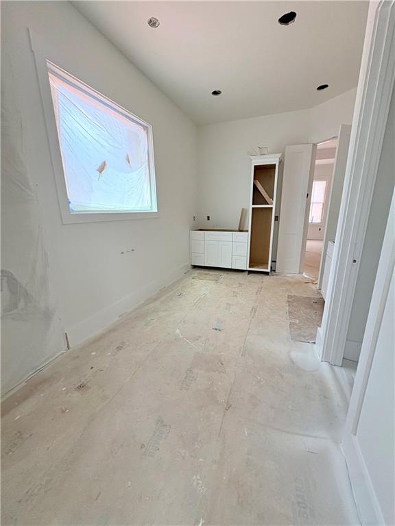 4013 Jersey Covington Road Covington, GA 30014 - Photo 10 of 29 an empty room with windows and cabinet