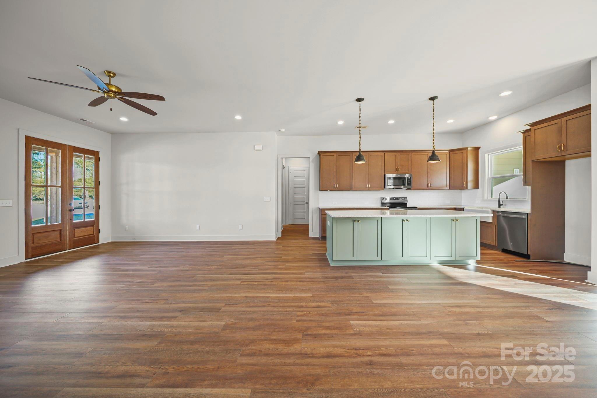 2417 Plyler Mill Road Monroe, NC 28112 - Photo 28 of 34 a view of kitchen with kitchen island wooden cabinets and refrigerator