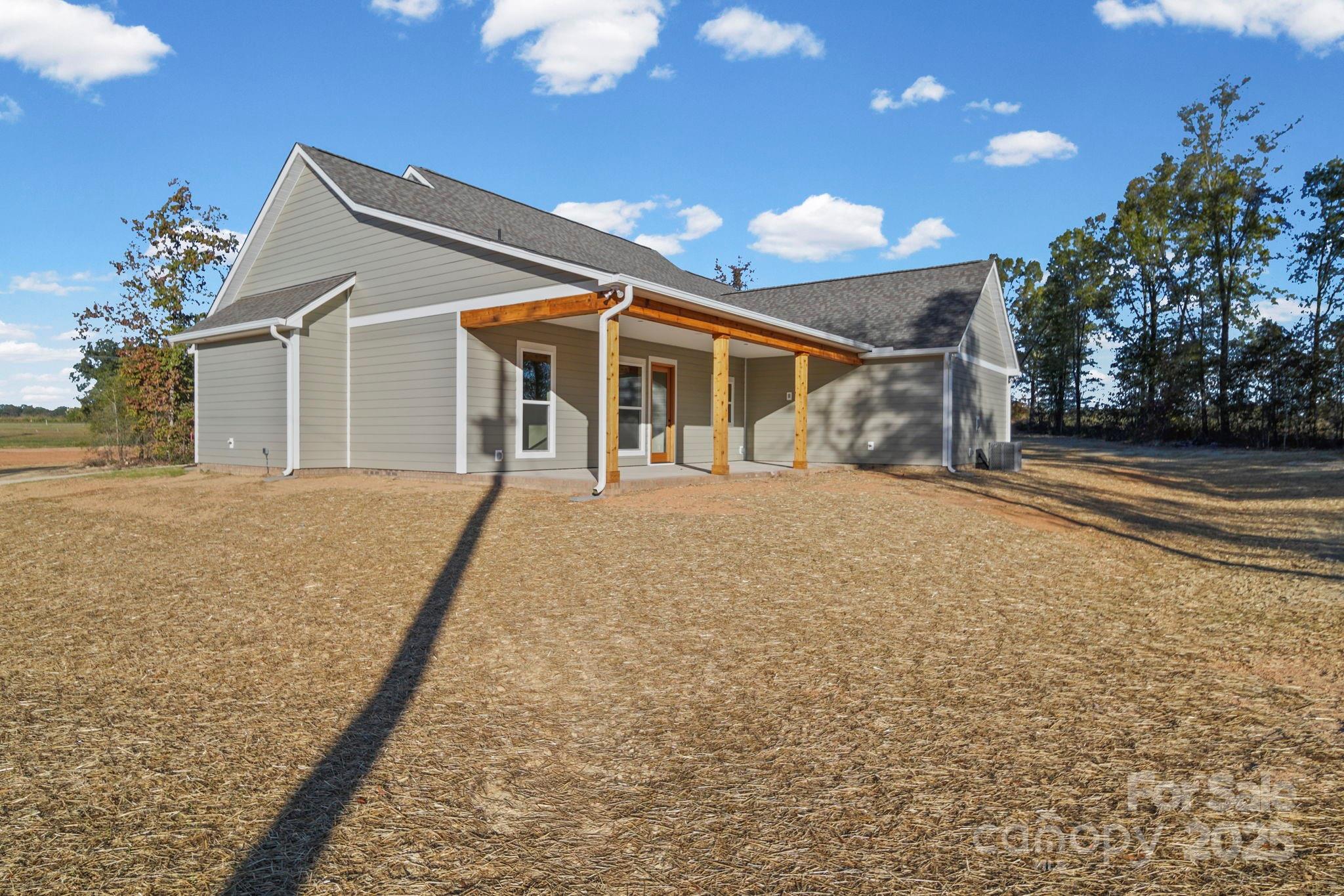 2417 Plyler Mill Road Monroe, NC 28112 - Photo 7 of 34 a view of a house with a yard