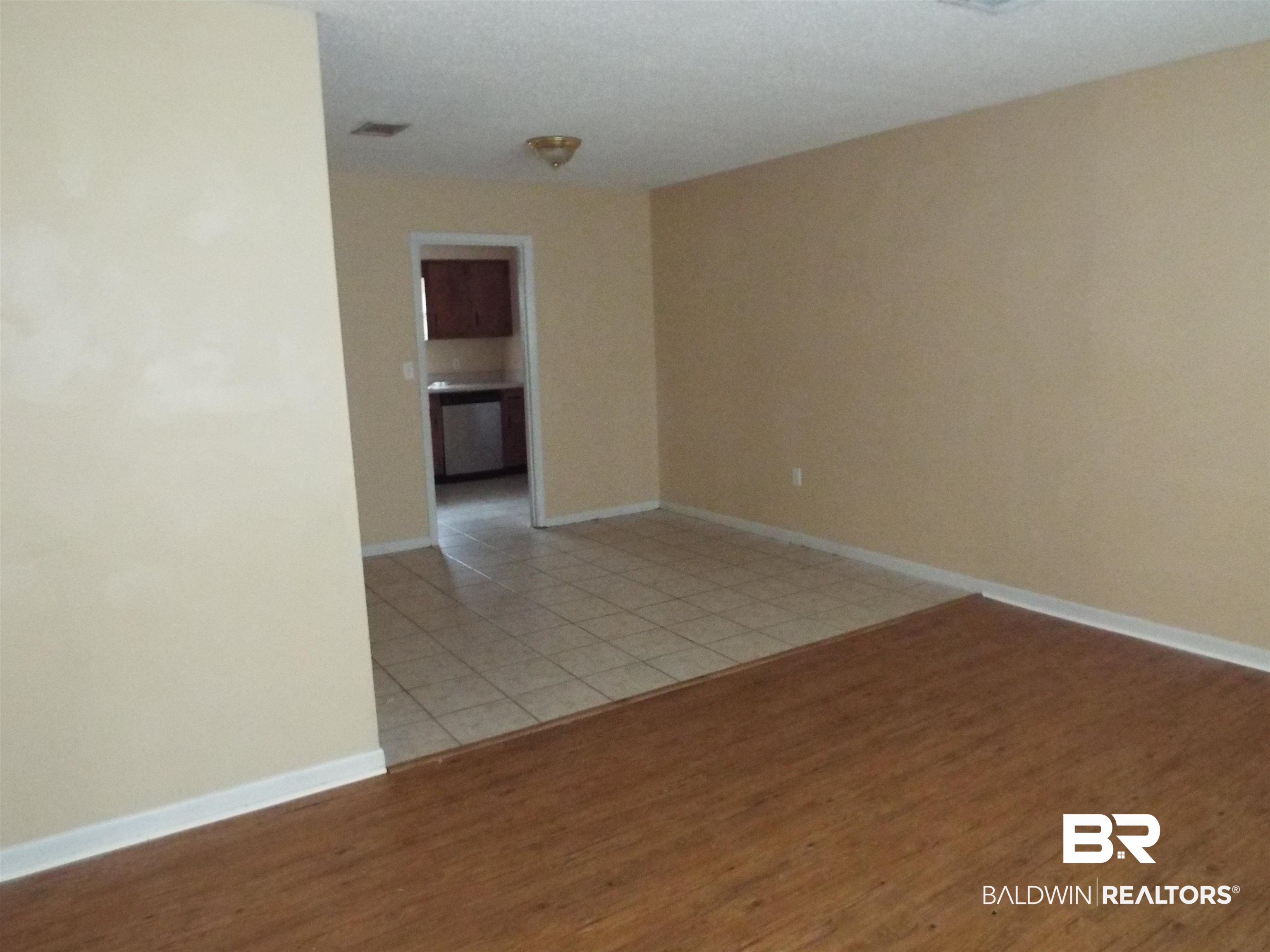 604 Southern Way Spanish Fort, AL 36527 - Photo 5 of 13 Unfurnished room with light wood-type flooring