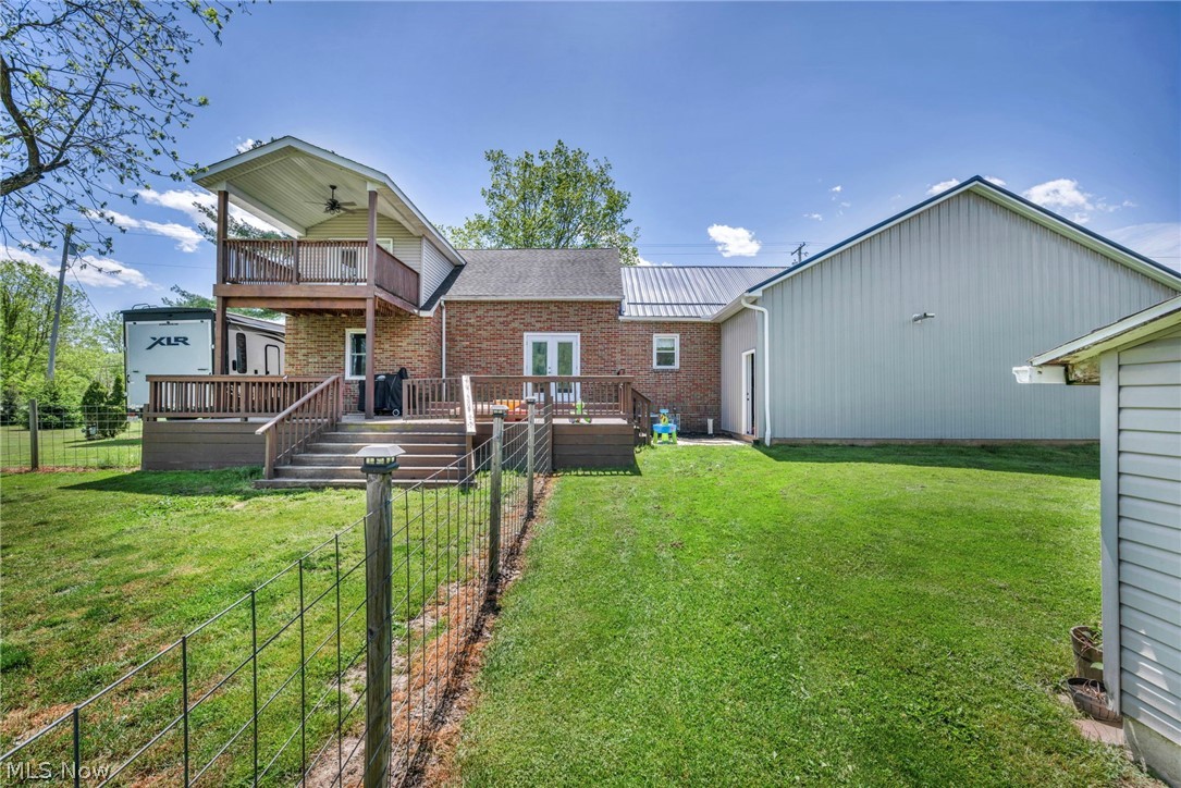 7983 Wadsworth Road Medina, OH 44256 - Photo 36 of 42 Back of house featuring a deck, a yard, and a balcony