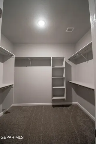 a view of an empty room with a fireplace