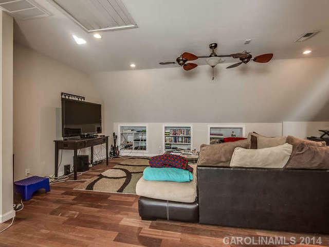 6713 Potter Road Waxhaw, NC 28173 - Photo 11 of 16 a living room with furniture and a flat screen tv