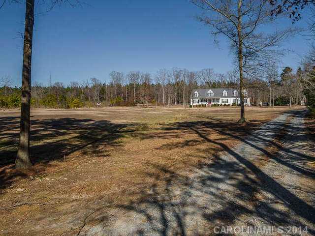 6713 Potter Road Waxhaw, NC 28173 - Photo 15 of 16 a view of a yard with an ocean view