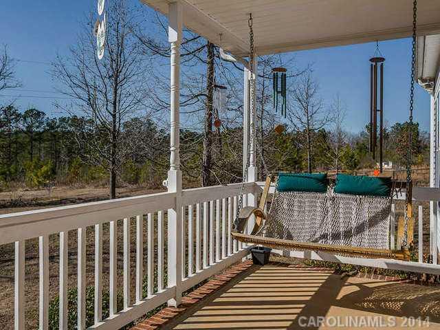 6713 Potter Road Waxhaw, NC 28173 - Photo 3 of 16 a view of a wooden deck