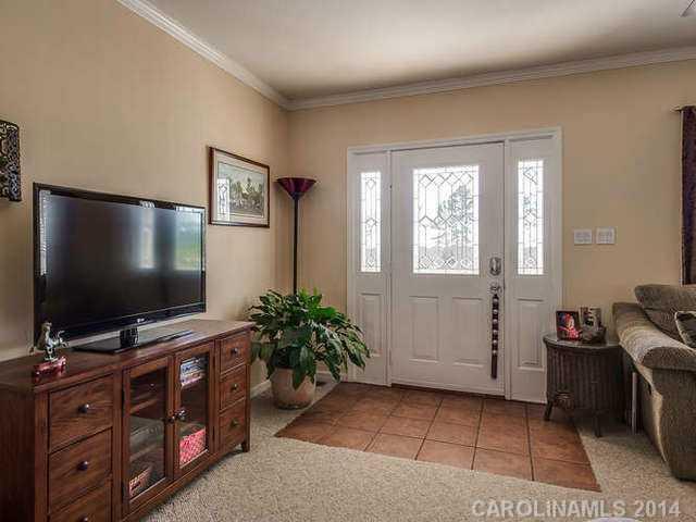 6713 Potter Road Waxhaw, NC 28173 - Photo 4 of 16 a living room with furniture and flat screen tv