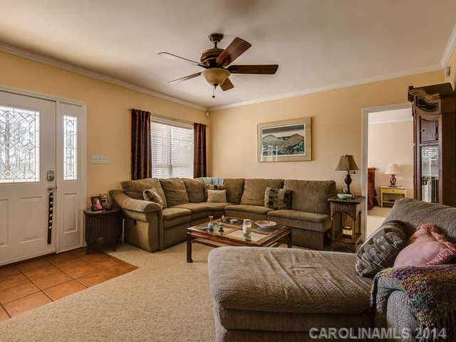 6713 Potter Road Waxhaw, NC 28173 - Photo 5 of 16 a living room with furniture and a large window