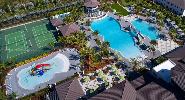 an aerial view of a swimming pool patio swimming pool and outdoor seating